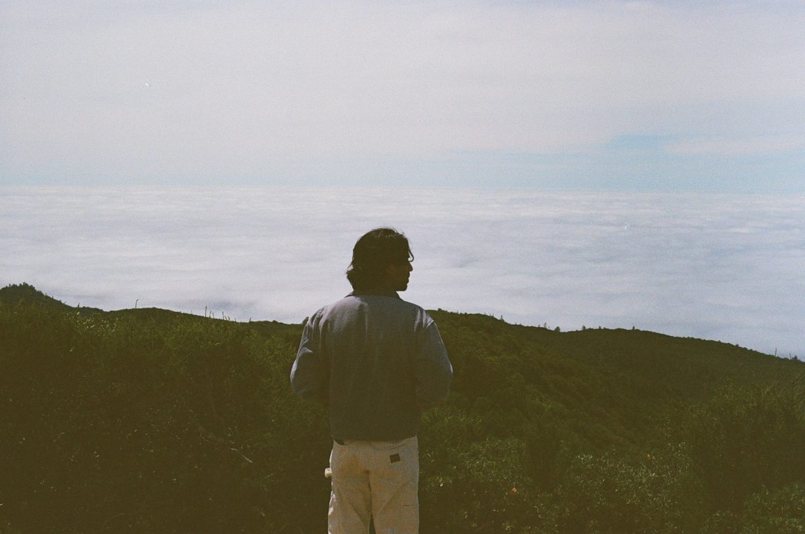 Standing above the cloud line on the ridge